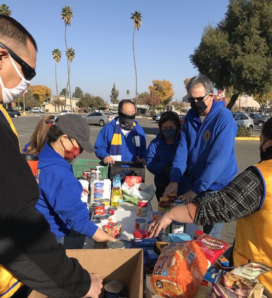 Kings Lions Club members accept donations Saturday from 10 a.m. to 2 p.m. for their Christmas Community Food Drive.